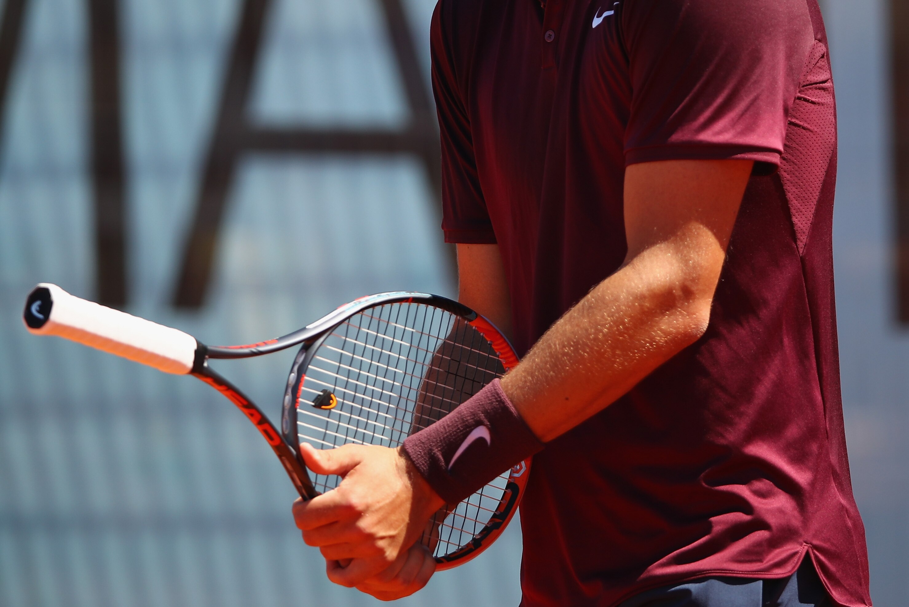 High res image of Tomic with racket inverted in Madrid Open