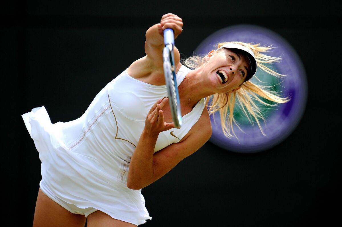 Tennis player grunting action shot