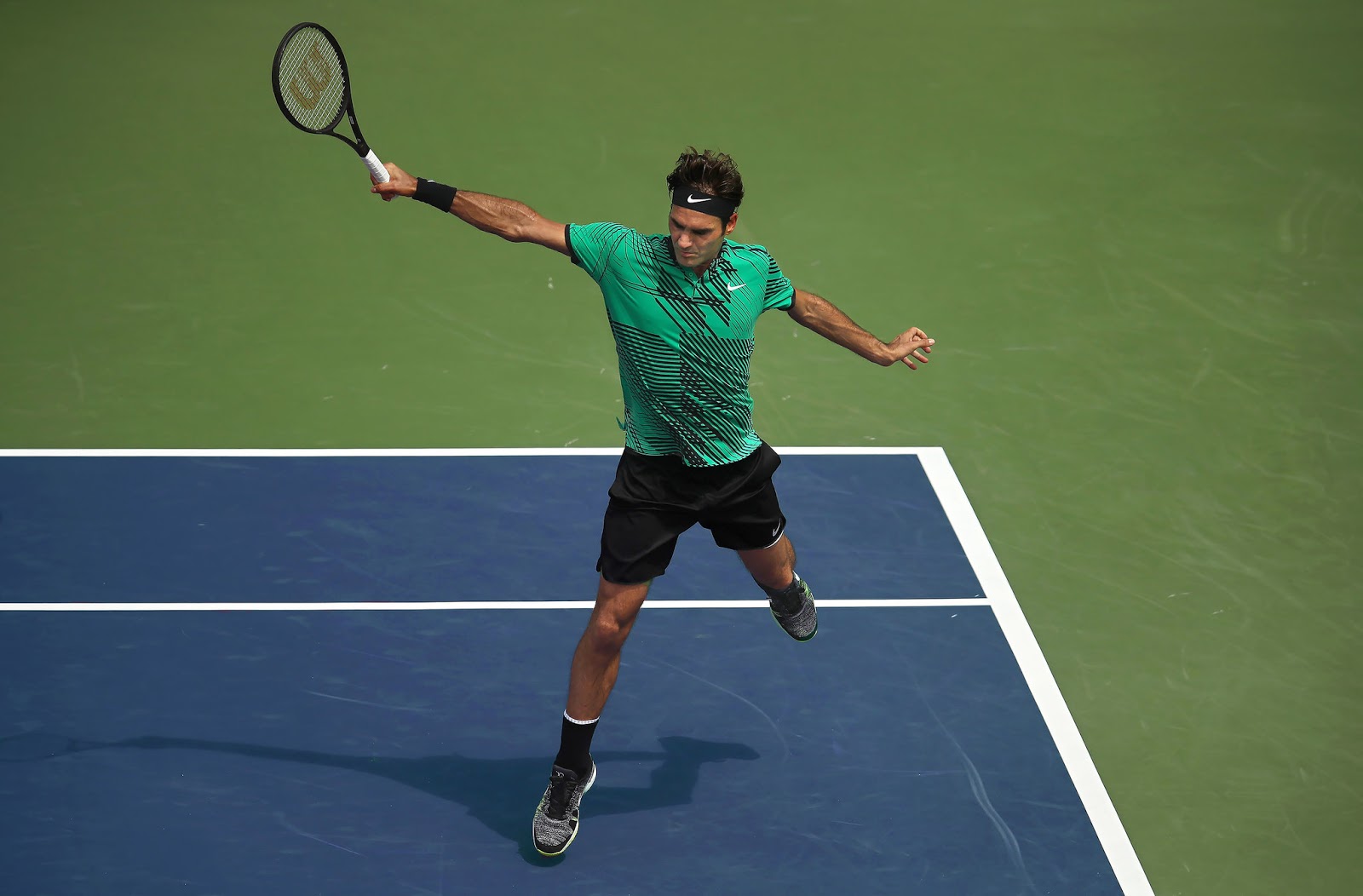 Roger Federer backhand uma mão